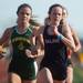 Huron's Kennedy Beazley and Saline's Elianna Shwayder during the girls mile run event at the Golden Triangle boys and girls track meet at Saline High School, Friday, May 3.
Courtney Sacco I AnnArbor.com